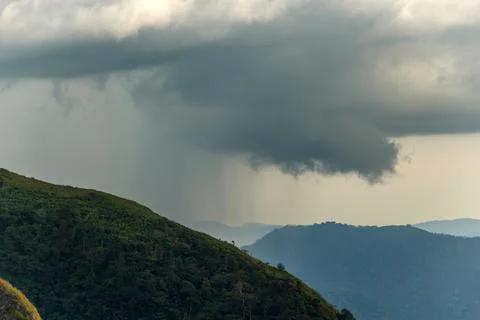 Rain Clouds Overlapping Green Mountain Slopes in Kerala Stock Photos