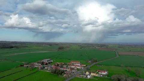 Rain clouds pass behind small English village, time lapse Stock-Footage 262896047