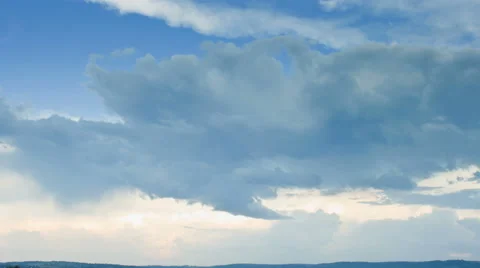 Rain clouds running over blue sky Stock Footage 41233277