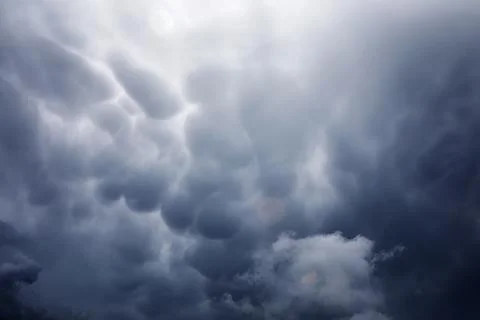 Rain clouds in the sky. Gray dark clouds in the sky. Storm clouds. Stock Photos