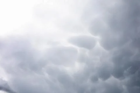 Rain clouds in the sky. Gray dark clouds in the sky. Storm clouds. Stock Photos