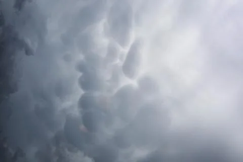 Rain clouds in the sky. Gray dark clouds in the sky. Storm clouds. Stock Photos