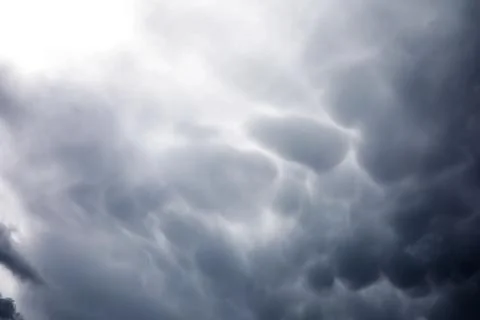 Rain clouds in the sky. Gray dark clouds in the sky. Storm clouds. Stock Photos