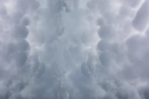Rain clouds in the sky. Gray dark clouds in the sky. Storm clouds. Stock Photos