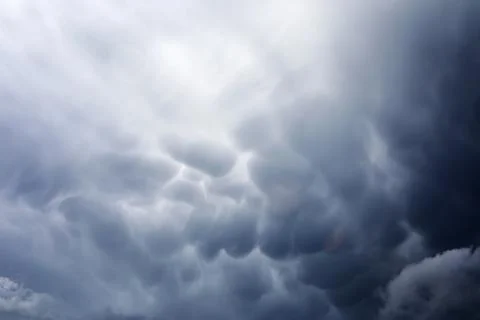 Rain clouds in the sky. Gray dark clouds in the sky. Storm clouds. Stock Photos