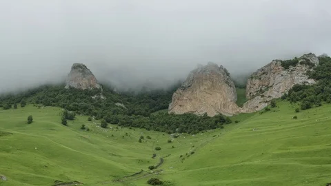 Rain clouds slowly cover the stony mountain slopes 動画素材 78106626