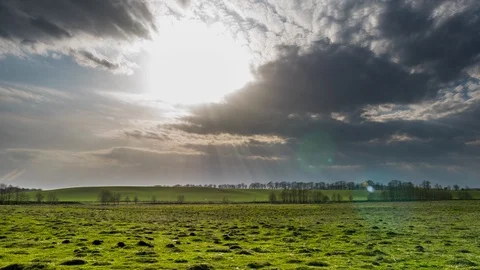 Rain clouds at wild field at spring. Time lapse Stock Footage 108334420