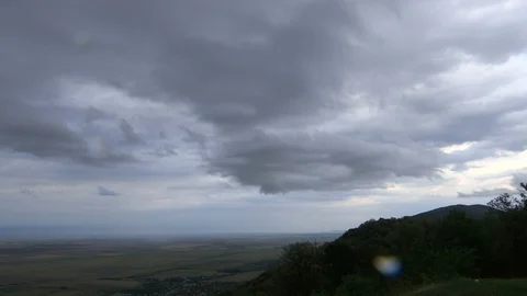 Rain comes over the plains and hills - TIME LAPSE Video stock 115895495