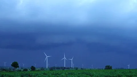 Rain coming around Wind turbines generating electricity. energy conservation  Stock Footage 78467332
