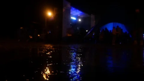 Rain at the concert. Night performance Stock Footage 117179157