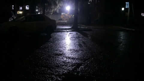 Rain in a dark courtyard at night Stock Footage 70073145