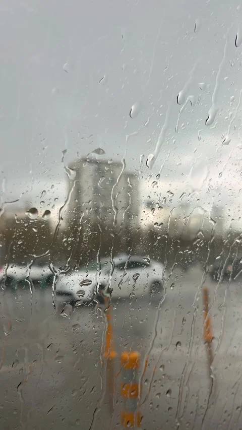 Rain day. Car window view of taxi, moped flow out of focus on city street Stock-Footage 347562716