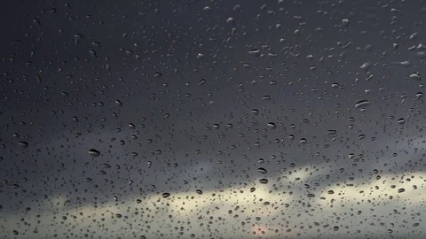 Rain days, heavy rain falling on window surface Stock Footage 97720485