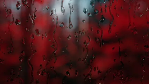 Rain days, rain falling on window surface on red horror background. Stock Footage 321532468