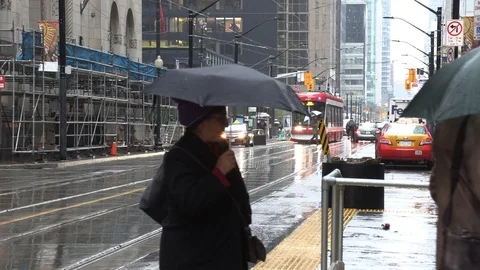 Rain in downtown Toronto with pedestrian... | Stock Video | Pond5