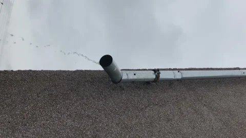 Rain drain pipe on the building. gutter, water flow, rainwater drainage.vertical Stock Footage 147894118