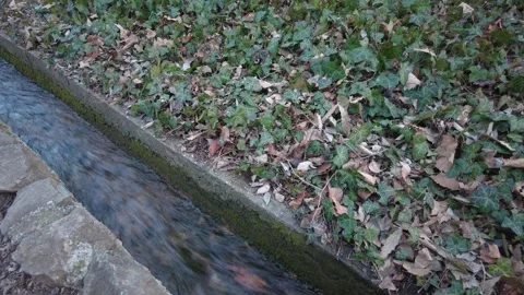 Rain drain. Rainwater runoff, ditch. Channel that is flooded with heavy rain. Stock Footage 266455892