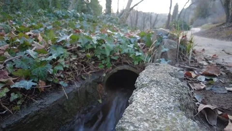 Rain drain. Rainwater runoff, ditch. Channel that is flooded with heavy rain Stock Footage 266884905