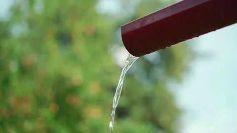 Rain drainage system, metal gutter with pouring water at rainy storm outdoor Video stock 242339956