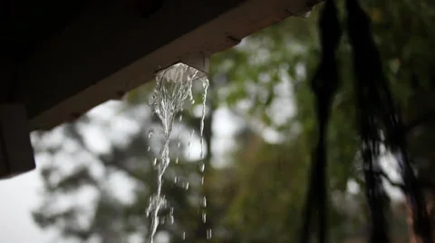 Rain draining through an open eaves trough Stock Footage 58631657