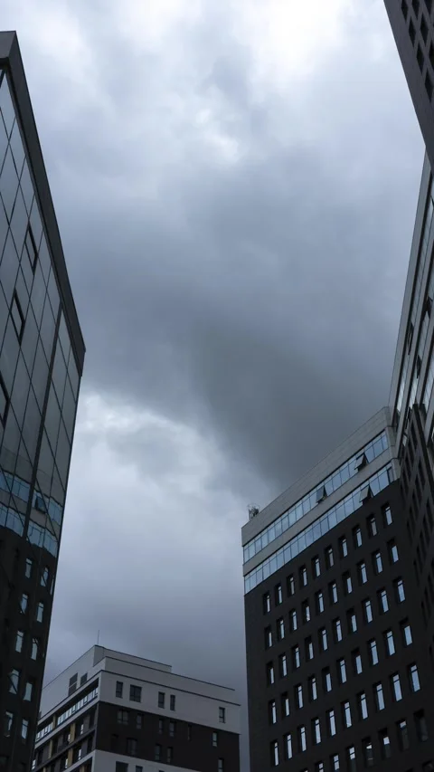 Rain dramatic clouds thicken over business office buildings. Stock Footage 282766402