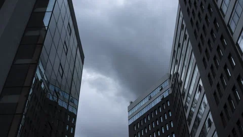 Rain dramatic clouds thicken over business office buildings. The twilight is Stock Footage 282861887