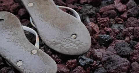Rain Dripping onto Discarded Sandals Stock Footage 227980130