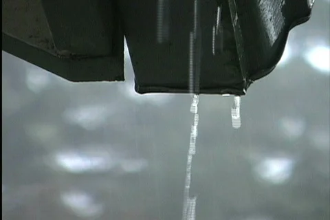 Rain dripping from gutter Stock Footage 745397