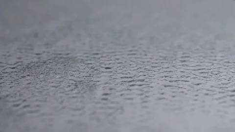 Rain dripping on a mirror with small drizzle droplets Stock Footage 76910045
