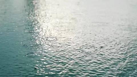 Rain Dripping Into a Swimming Pool Video stock 136640194