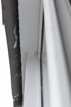 Rain drips between the window frame and the ceiling. Roof damage due to poo.. Stock Photos