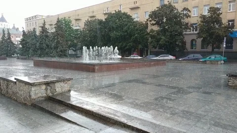 Rain drips from umbrella at working fontain Stock Footage 123655982