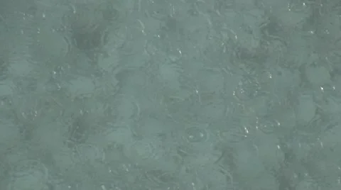 Rain drips in water Stock Footage 10732098
