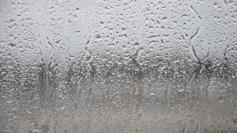 Rain drips on the window. Jets of water run down the glass. Stock Footage 123412048