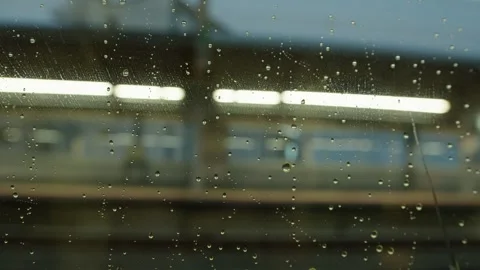 Rain on driving train window Stock Footage 321757155