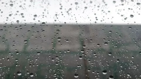 Rain drizzling on the windowpane Stock Footage 225890652