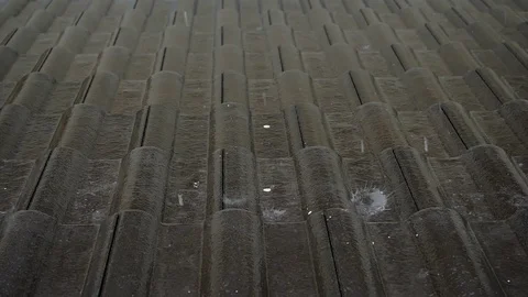 Rain drop on black tile roof house, slow motion rainy day scene Stock Footage 113396830