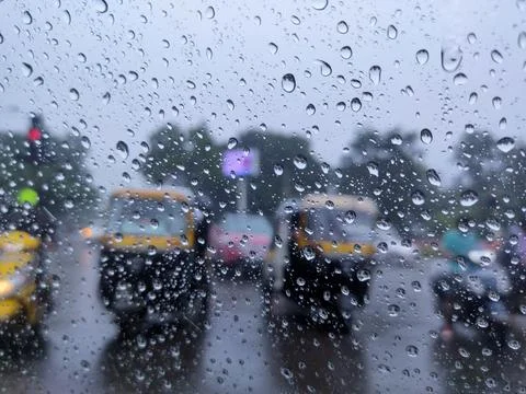 Rain drop on the car glass. Road TRAFFIC view through car window. Stock Photos