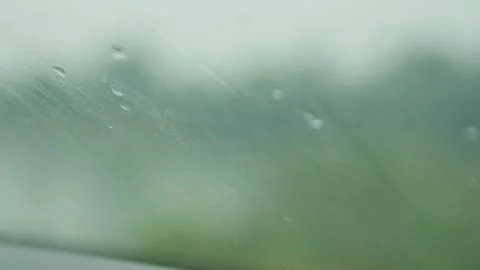 Rain drop on car windshield window glass wiped by wiper blade Stockbeeldmateriaal 342799694