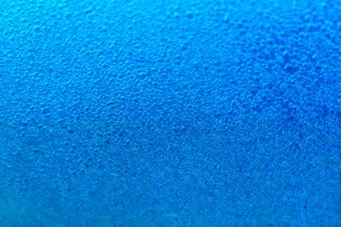 Rain drop on dark blue surface. Spring morning mood. Bright background or wal Stock Photos