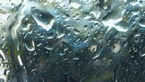 Rain drop falling on window, summer rainy day, closeup Stock Footage 110730236