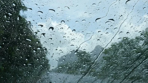 Rain drop in front of car windshield Stock Footage 101001731
