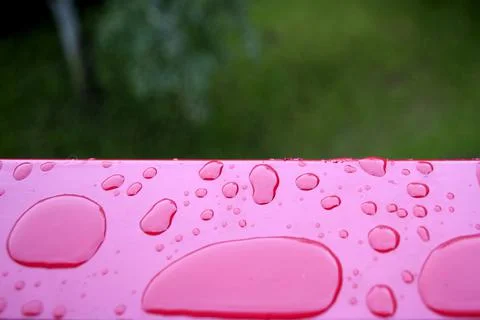Rain drop  red metal plan Stock Photos