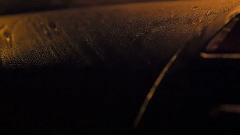 Rain drop shadows on car dash board Vídeos de archivo 73718380