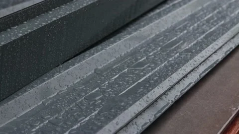 Rain drop water falling splashing on wood terrace Stock Footage 166833342