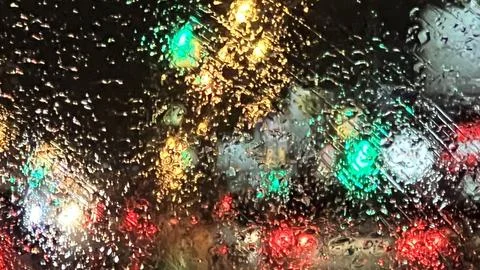 Rain drop on window, rainy day. eavy downpour on the road. Global climate. Stock Photos