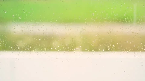 Rain drop on window with softfocus rainy background Stock Footage 251858306
