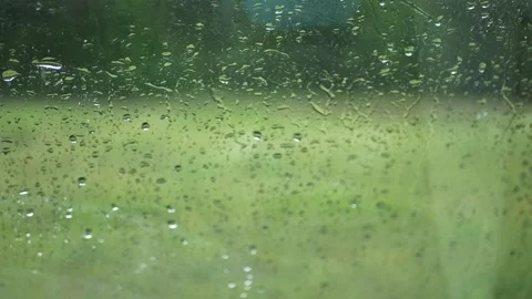 Rain Drop On Windshield With Blur Green Grass Background Video stock 131405897