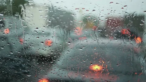 Rain Drop On Windshield With Blur Light Of Vehicle Car Traffic Jam Stock Footage