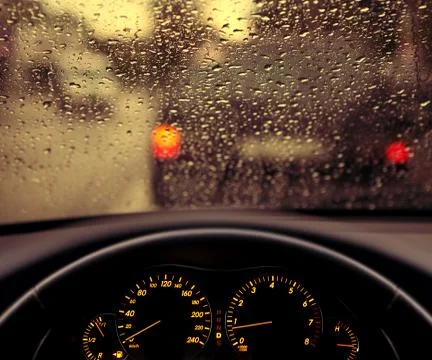 Rain droplets on car windshield Stock Photos